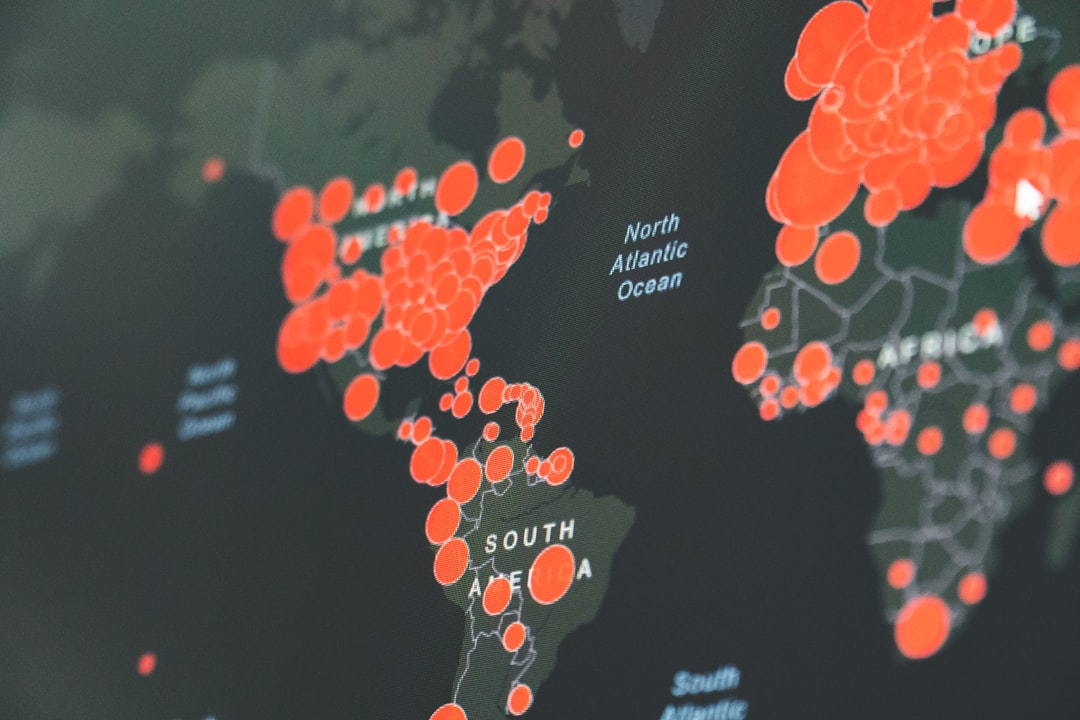 Person using laptop with VPN to access restricted internet content worldwide