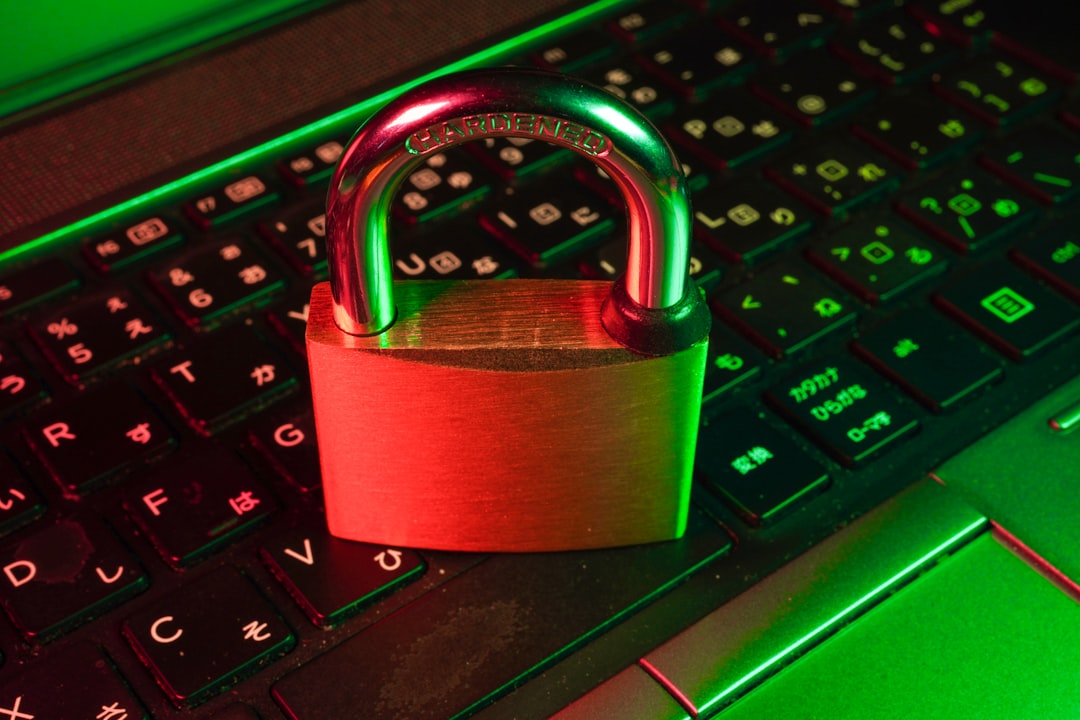 Person using laptop with VPN shield icon representing enhanced online privacy and security